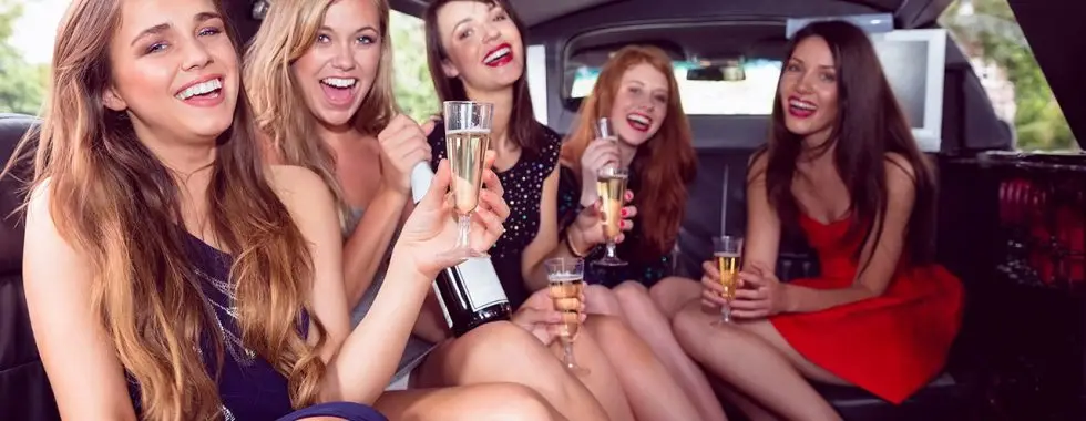 a group of women in a limo