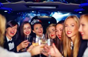 a group of women in a limo