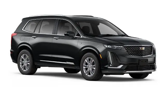 a black car with a white background with Holden Arboretum in the background