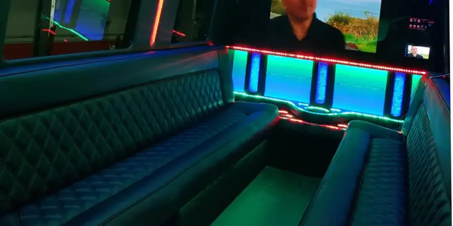 two leather seats inside the limousine party bus rental